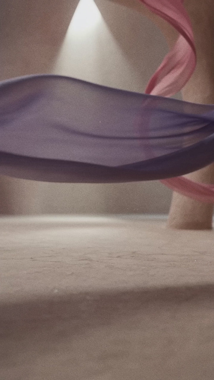 Close-up video showcasing the luxury Valloria perfume bottle with golden amber liquid and minimalist branding.