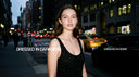 Valloria Bliss luxury perfume campaign banner featuring an elegant woman on a city street at night with the text 'Dressed in Darkness, Drenched in Desire'.